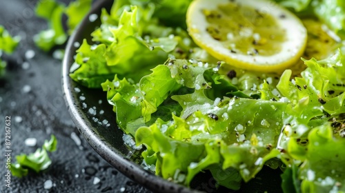 French cuisine. Green salad with lemon vinaigrette. photo