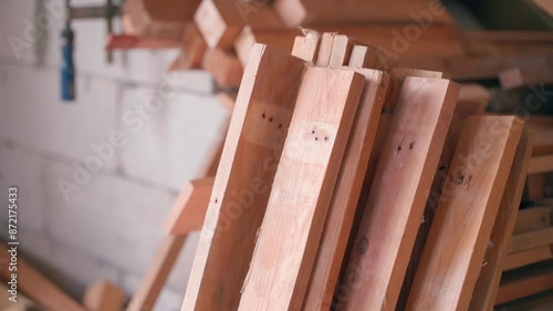 Warehouse in a carpenter's workshop with different boards, smooth camera movement photo