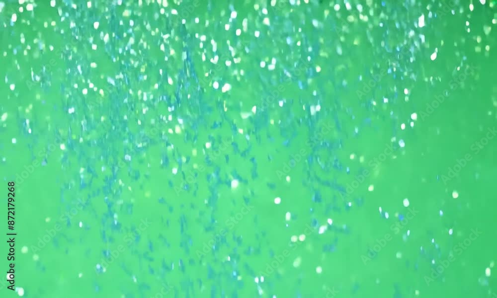 A green background with a lot of white specks. The background is very bright and lively. The white specks are scattered all over the background, giving it a sense of movement and energy A green background with a lot of white specks. The background is very bright and lively. The white specks are scattered all over the background, giving it a sense of movement and energy
