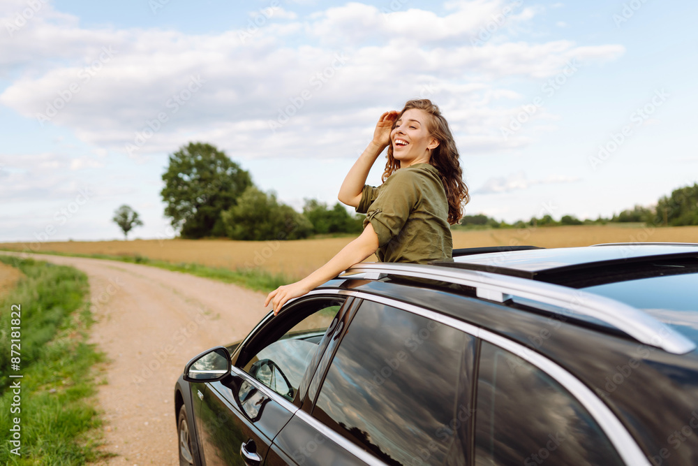 Summer car trip. Beautiful woman on road travel in the car. Lifestyle, travel, tourism, nature, active life. Summer car trip. Beautiful woman on road travel in the car. Lifestyle, travel, tourism, nature, active life.