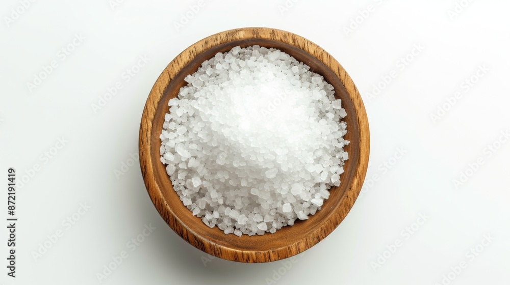 Top view of salt in a wooden bowl on a white background Top view of salt in a wooden bowl on a white background