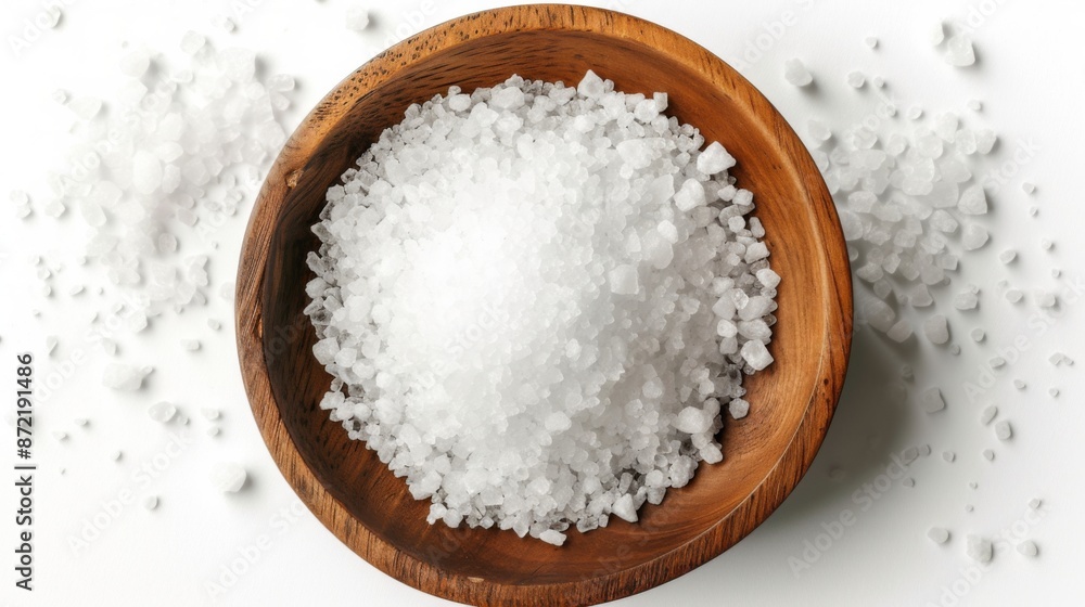Top view of salt in a wooden bowl on a white background Top view of salt in a wooden bowl on a white background