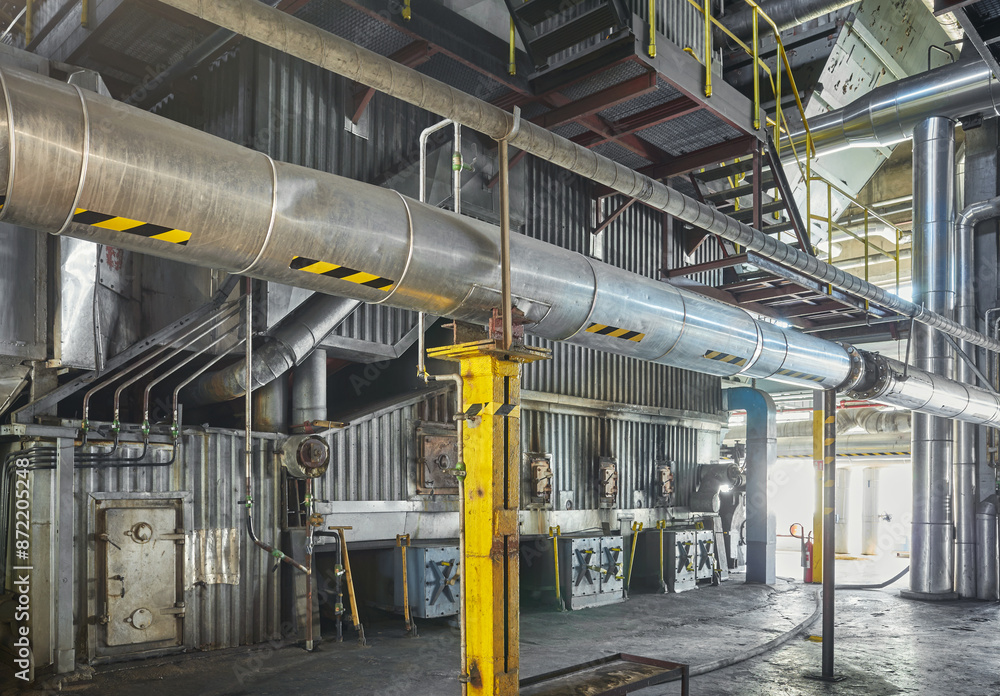 Interior of an old coal fired heating plant supplying heat to a district heating network. Interior of an old coal fired heating plant supplying heat to a district heating network.