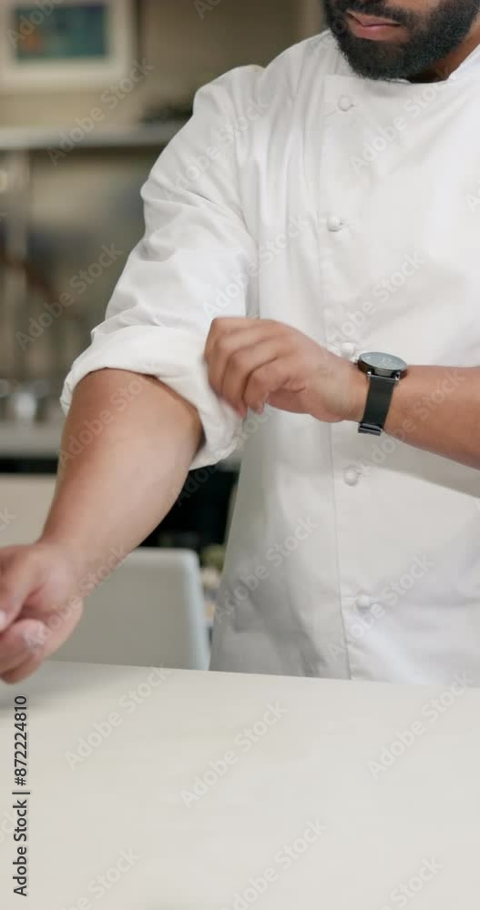 Chef, man and rolling for sleeves in kitchen of career with food, safety and hygiene for cooking cuisine dinner. Male person, culinary and arms for mobility, comfort and meal prep of hospitality shop Chef, man and rolling for sleeves in kitchen of career with food, safety and hygiene for cooking cuisine dinner. Male person, culinary and arms for mobility, comfort and meal prep of hospitality shop