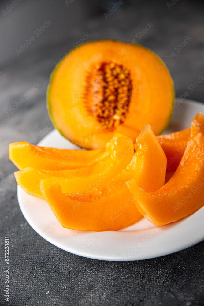 Melon Charentais sweet fruit fresh appetizer meal food snack on the table copy space food background rustic top view keto or paleo diet vegetarian vegan food Melon Charentais sweet fruit fresh appetizer meal food snack on the table copy space food background rustic top view keto or paleo diet vegetarian vegan food