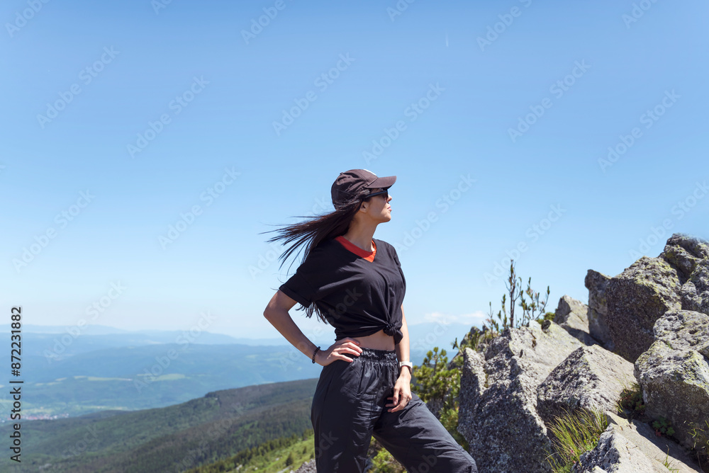 Fototapeta premium Traveler Woman on a peak in the summer mountain .Vitosha Mountain ,Bulgaria 