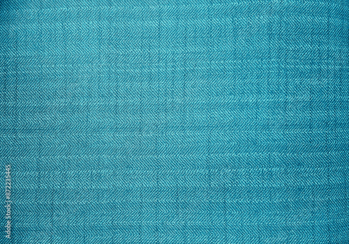 close up blue color fabric texture. fabric herringbone, zigzag, chevron pattern. cyan upholstery or drapery abstract textile fabric background for design.