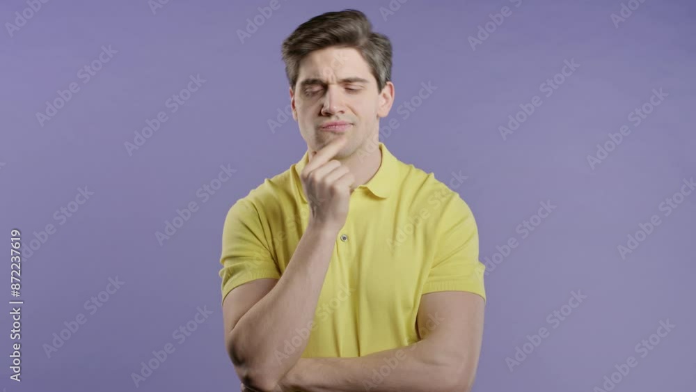 Thinking around man on violet background. Smart student 30s guy finding answer Thinking around man on violet background. Smart student 30s guy finding answer