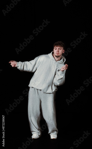 Dynamic hip-hop dancer in action on a black background