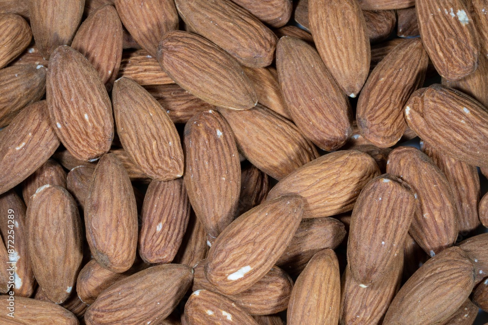 Fototapeta premium Close-up of a pile of raw almonds