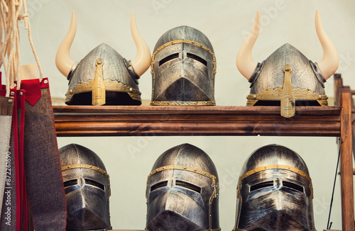 Canvastavla Ribeauvillé, Alsace, France - December 8, 2019: Medieval exposition for winter holidays fair showcase traditional antique knight helmets and viking armour suite for head protection