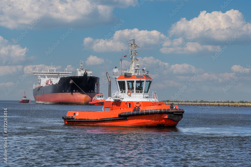 Port of Gdansk, Poland, a large tanker PEARY SPIRIT enters the port, accompanied by the port tugs Port of Gdansk, Poland, a large tanker PEARY SPIRIT enters the port, accompanied by the port tugs