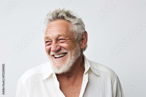 Portrait of a happy senior man laughing. Isolated on white background.