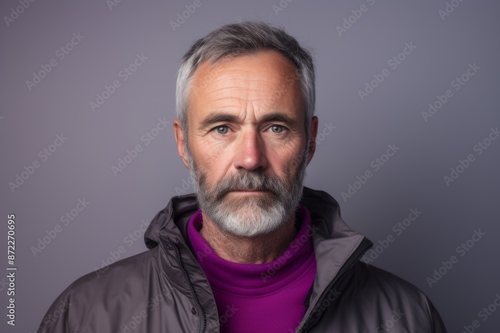 Obraz premium Portrait of a senior man with grey beard and mustache. Studio shot.