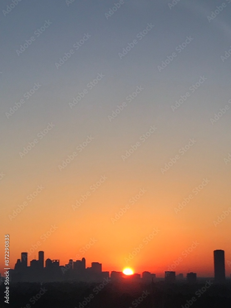 Orange to Blue Sunrise over Houston skyline Orange to Blue Sunrise over Houston skyline