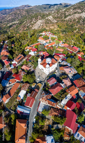 Drone flying above traditional village of Pedoulas with church in Troodos mountains. Nicosia District, Cyprus photo