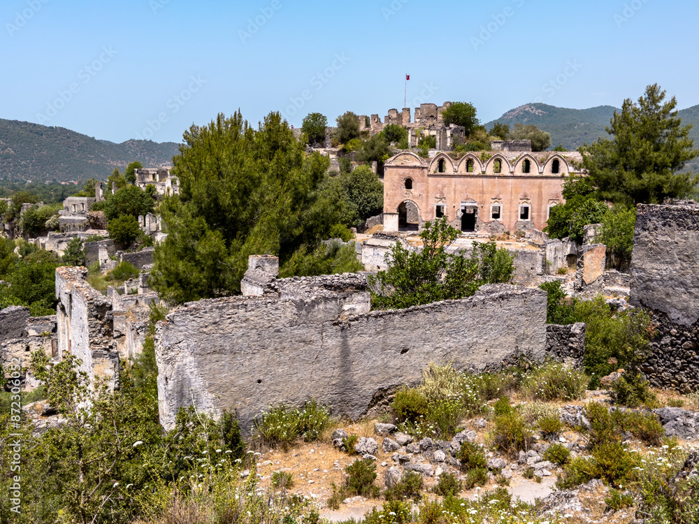Ruins of abandoned village Kayakoy in Turkey ghost town, ruined church and castle Ruins of abandoned village Kayakoy in Turkey ghost town, ruined church and castle