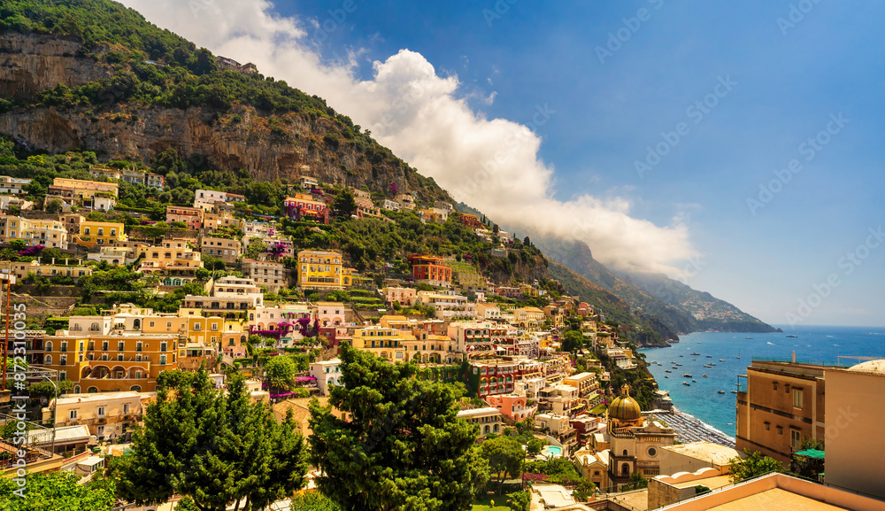 View of Positano with comfortable beach and blue sea on Amalfi Coast in Campania, Italy. Positano village on the Amalfi Coast, Salerno, Campania. Beautiful Positano, Amalfi Coast in Campania.