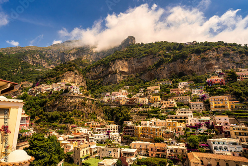Obraz na płótnie View of Positano village along Amalfi Coast in Italy in summer with cloud formation on top of the hill w salonie