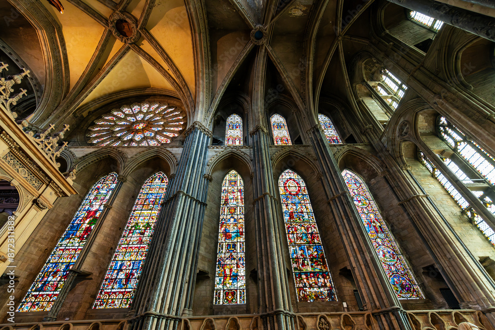 Fototapeta premium The Rose Window and stained glass window panels in the nave of the medieval Durham Cathedral Church of Christ in Durham, England UK.