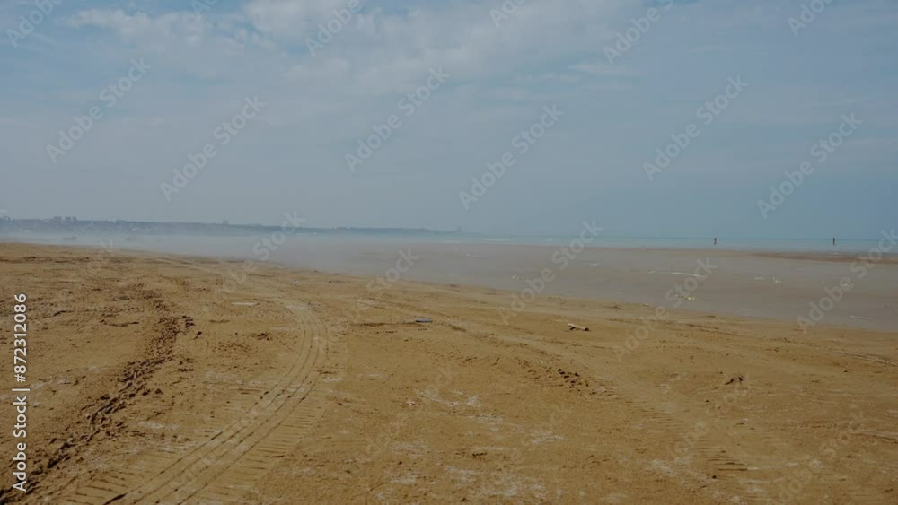 Relaxing sea with yellow sand. Wind of water vapor flow Relaxing sea with yellow sand. Wind of water vapor flow