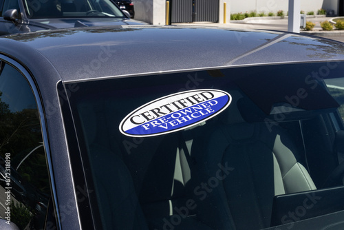 Certified Pre-Owned vehicle sign on a used car. With high price concerns, used and pre-owned vehicles are in high demand.