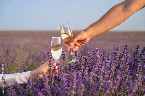 Two People Toasting With Wine in a Lavender Field