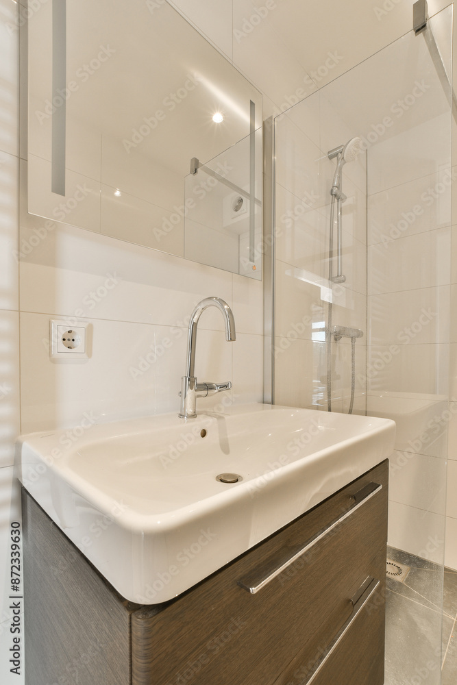 Modern bathroom with sink, shower, and elegant designs Modern bathroom with sink, shower, and elegant designs