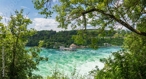Beautyful sunny summer day at Rheinfall Switzerland near Schaffhausen. Atmospheric scene with blue sky and a nice view at the waterfall.