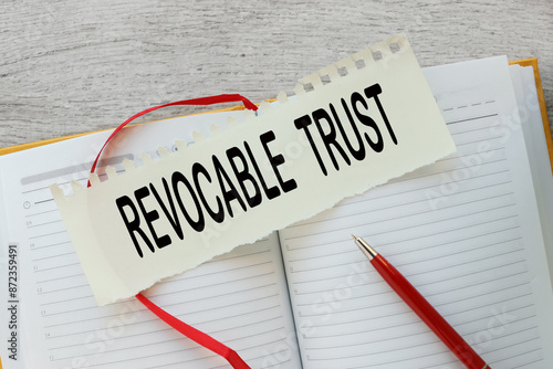 Irrevocable trust text on a torn page on a notepad