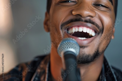 An individual intensely plays the guitar close-up, suggesting passion and dedication. The viewer's focus is brought to the detailed hands and musical talent. photo