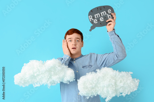 Shocked young man holding s...
