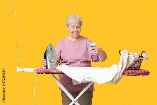 Happy senior woman with bas...