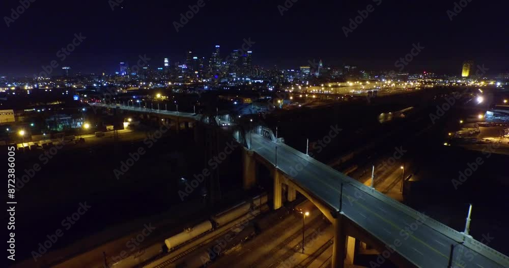 Aerial Backward Shot Of Illuminated Viaduct Bridge In Modern City Against Clear Sky At Night - Los Angeles, California Aerial Backward Shot Of Illuminated Viaduct Bridge In Modern City Against Clear Sky At Night - Los Angeles, California