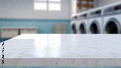 Folded towels on countertop with laundry machine in background. White table in front of washing machine with blurring background. Home comfort and modern lifestyle concept for interior design. AIG35.