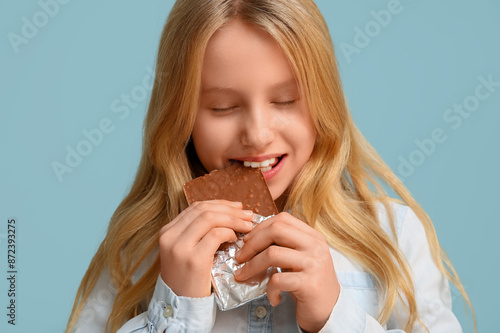 Little girl eating tasty ch...
