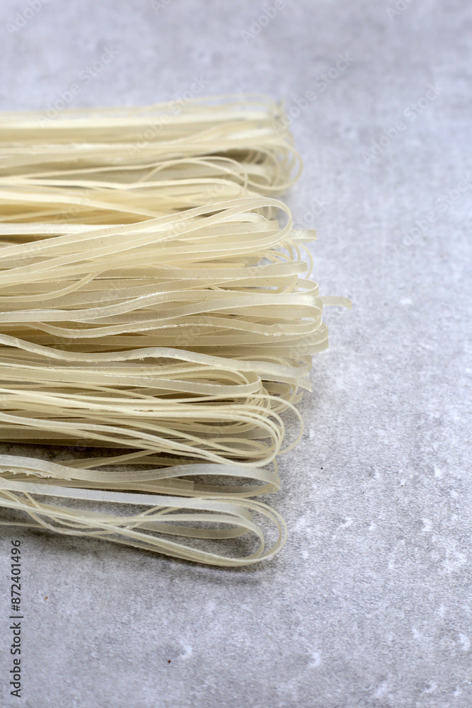 Dried uncooked rice noodles. Raw rice flour noodles Dried uncooked rice noodles. Raw rice flour noodles