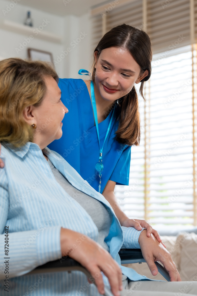 Fototapeta premium Caring Nurse Assisting Elderly Woman at Home - Compassionate Home Care Services for Seniors