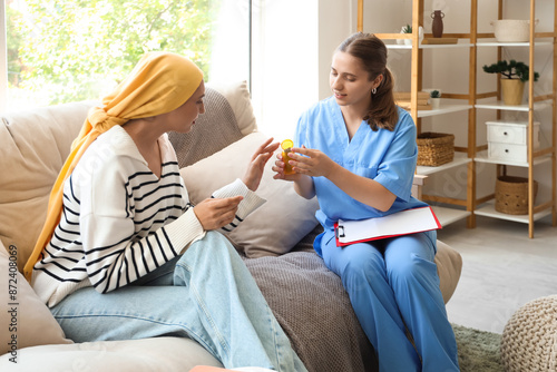 Female doctor giving bottle...