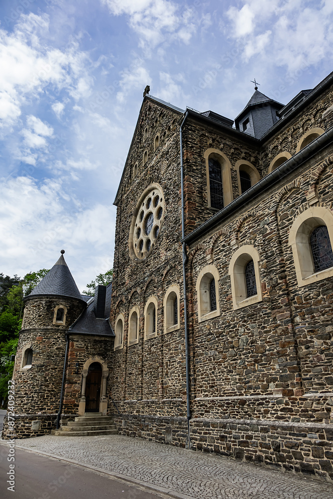 View of Saints Cosmas and Damian Church (Eglise Saints-Come-et-Damien) with two spires. Clervaux, Luxembourg. View of Saints Cosmas and Damian Church (Eglise Saints-Come-et-Damien) with two spires. Clervaux, Luxembourg.