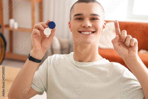 Young man with contact lens...
