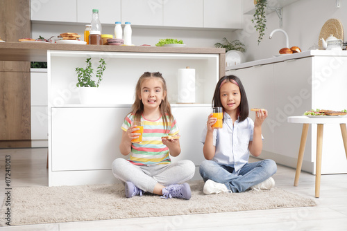 Cute little girls with tast...