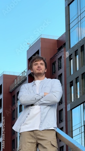 Wallpaper Mural Happy young confident successful businessman standing outdoors Torontodigital.ca