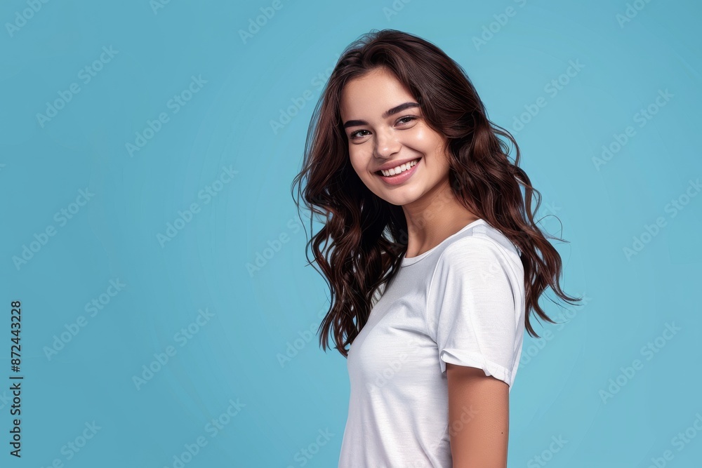 Pretty Young Woman on Blue Background - Happy Expression, White T-Shirt, Copy Space Pretty Young Woman on Blue Background - Happy Expression, White T-Shirt, Copy Space