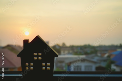 House model in home insurance broker agent’s hand with building background. Real estate agent offer house, property insurance concepts. © sommart