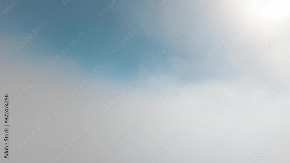 A view of mountains peeking through clouds under a clear blue sky in Malibu California A view of mountains peeking through clouds under a clear blue sky in Malibu California
