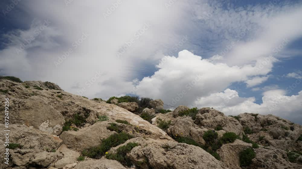 Timelapse of a large cumulus clouds on top of a rocky mountain Timelapse of a large cumulus clouds on top of a rocky mountain