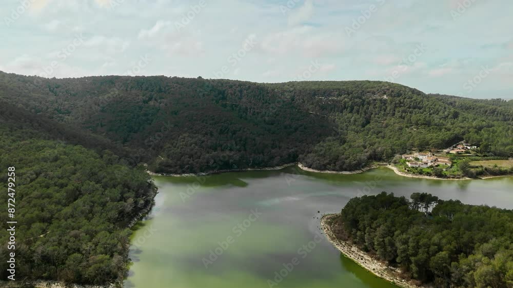 Drone wide shot of a winding river between green forests Drone wide shot of a winding river between green forests