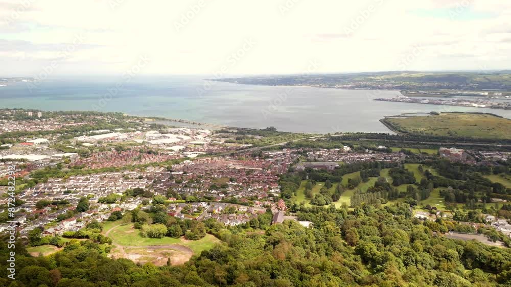 Aerial shot of Belfast from Cavehill mountain in Northern Ireland.
Filmed on a sunny day, the camera passes over fields to reveal the city.
Filmed in 4K, 60 frames per second and in Rec709 colour. Aerial shot of Belfast from Cavehill mountain in Northern Ireland.
Filmed on a sunny day, the camera passes over fields to reveal the city.
Filmed in 4K, 60 frames per second and in Rec709 colour.