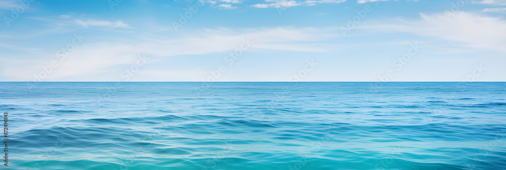 Fototapeta premium Mesmerizing Blue Ocean Expanse: A Symbiosis of Sky, Water, and Light